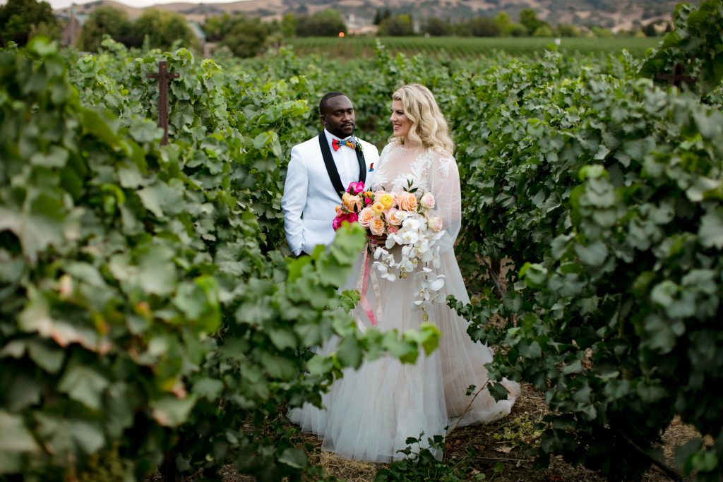 Bride and groom amongst the vineyards at the Palm Event Center.