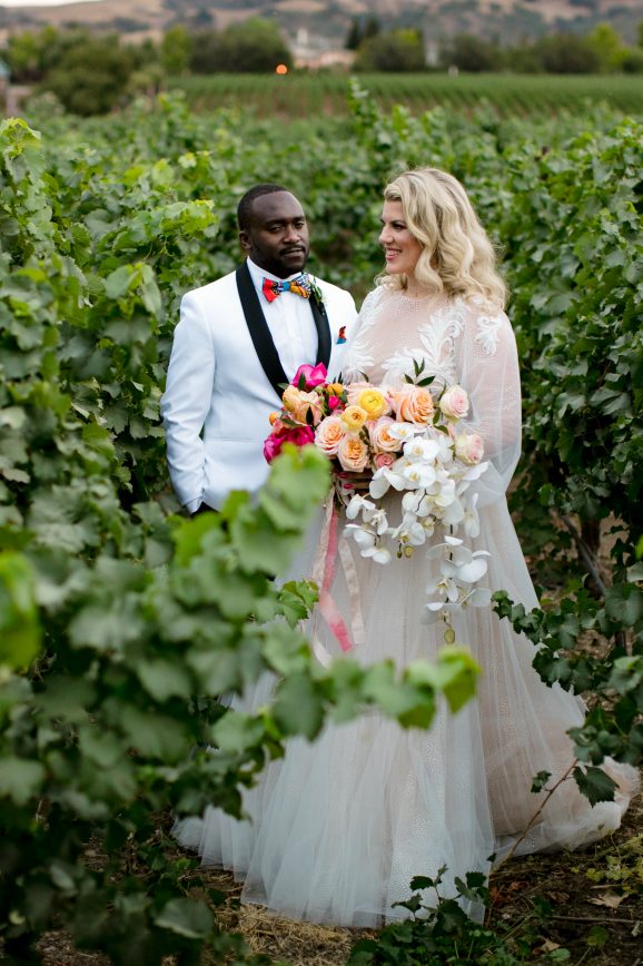Wedding couple in the vineyards at the Palm Event Center.