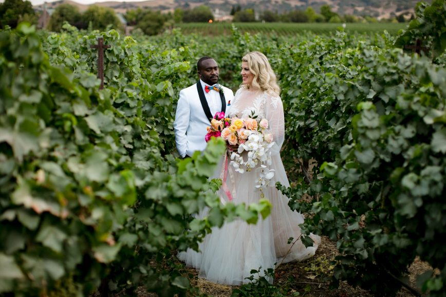 Wedding couple in the vineyards at the Palm Event Center.